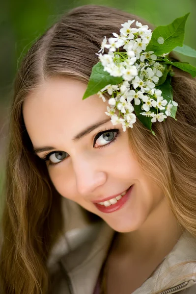 Girl with flowers in her hair — Stock Photo, Image