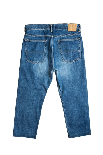 Синие джинсы на белом фоне — стоковое фото