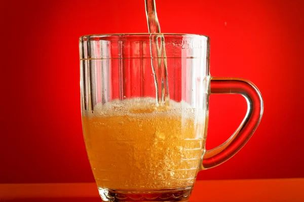 Beer on red — Stock Photo, Image