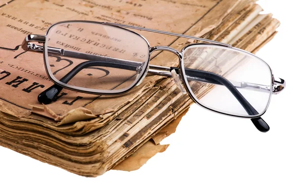 Old book with glasses macro — Stock Photo, Image