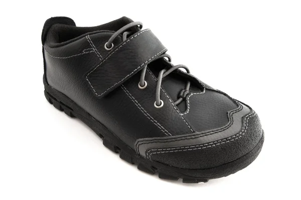 Schwarzer Schuh auf Weiß — Stockfoto