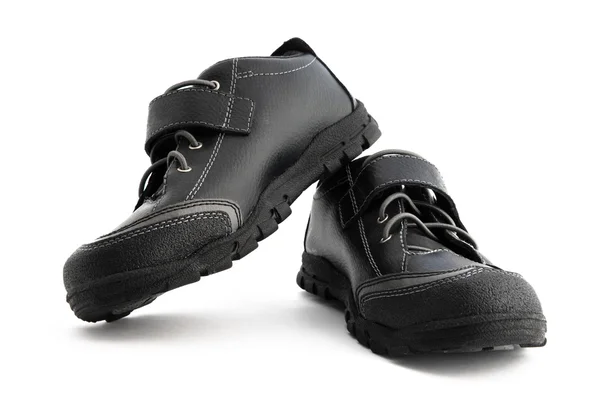Schwarzer Schuh auf weißem Hintergrund — Stockfoto