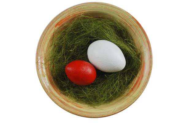 Two eggs in a plate with green grass — Stock Photo, Image