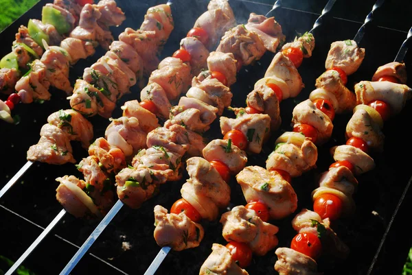 Grilled meat on metal skewers — Stock Photo, Image