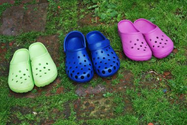 Three pairs of rubber slippers clipart