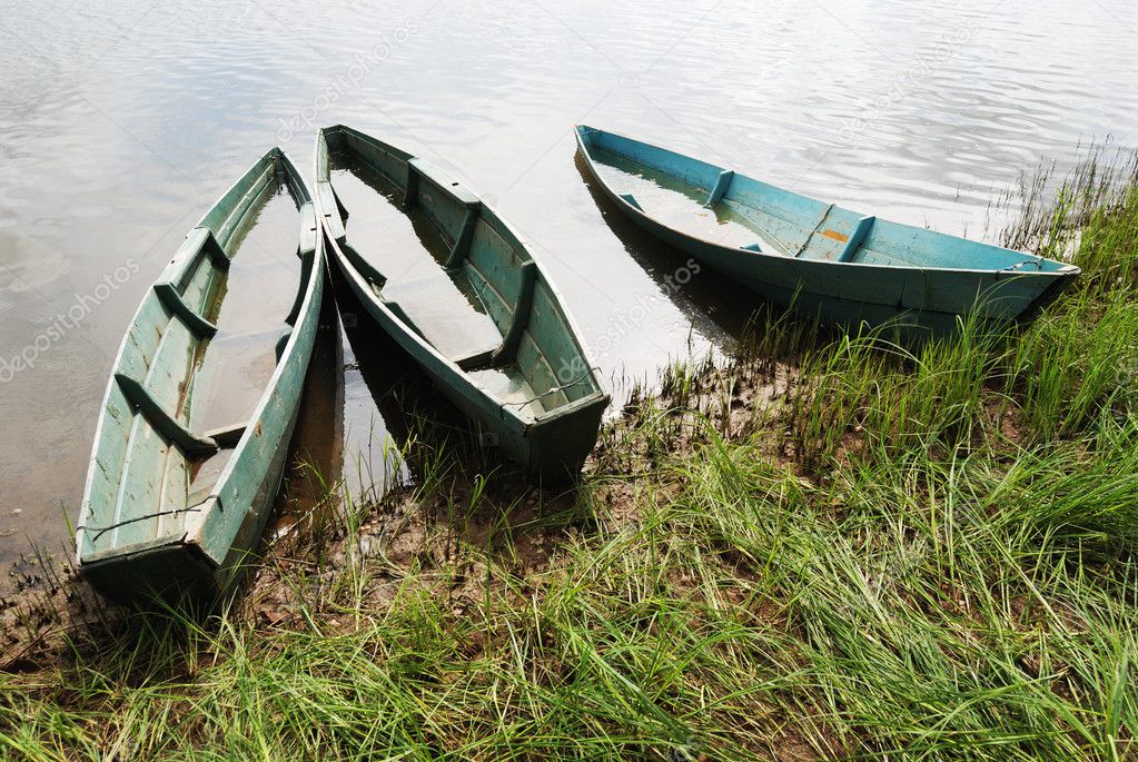 Three wooden boats