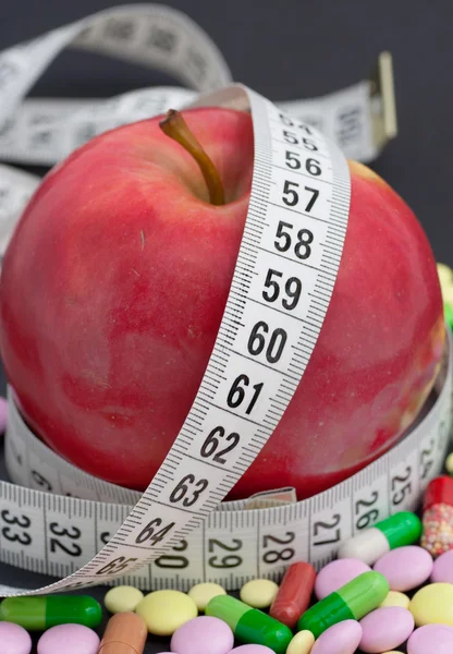 stock image Red apple and pill