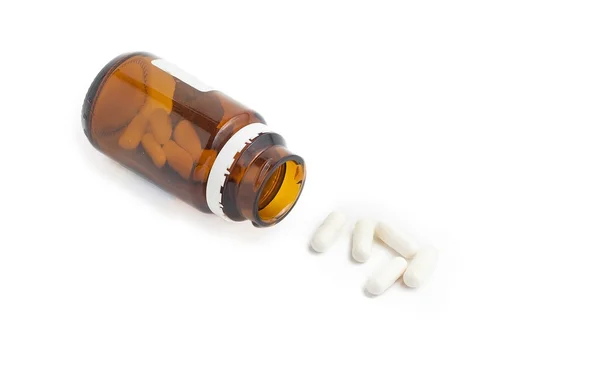 Närbild bild av medicin som rinner från flaska — Stockfoto