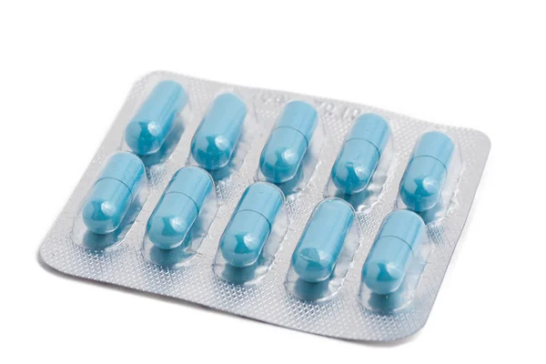 Balení pilulek izolovaných na bílém — Stock fotografie