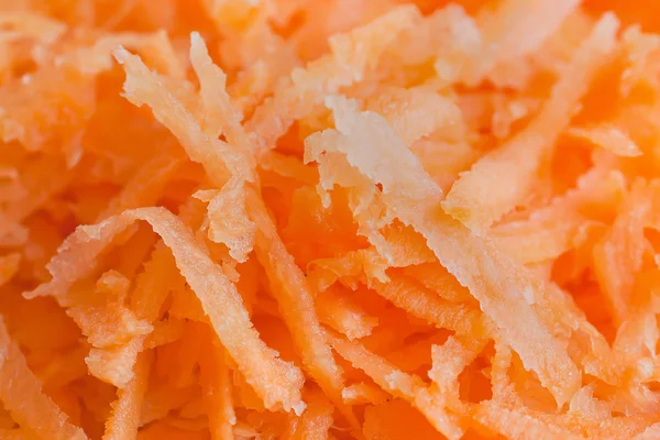 Geraspte wortelen op rasp — Stockfoto