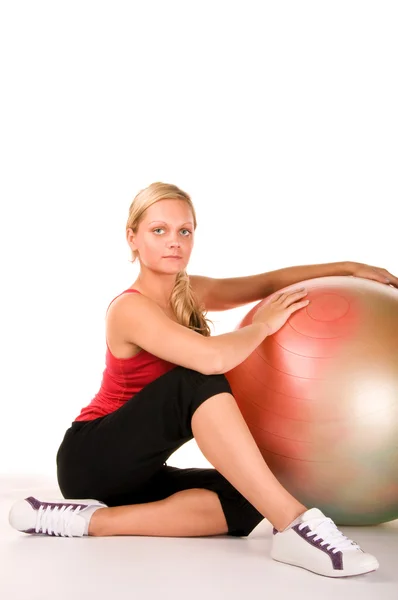 Chica rubia haciendo ejercicio con una pelota de pilates —  Fotos de Stock
