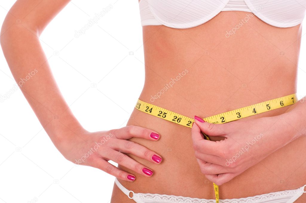 Young woman measuring her waist, isolated on white background