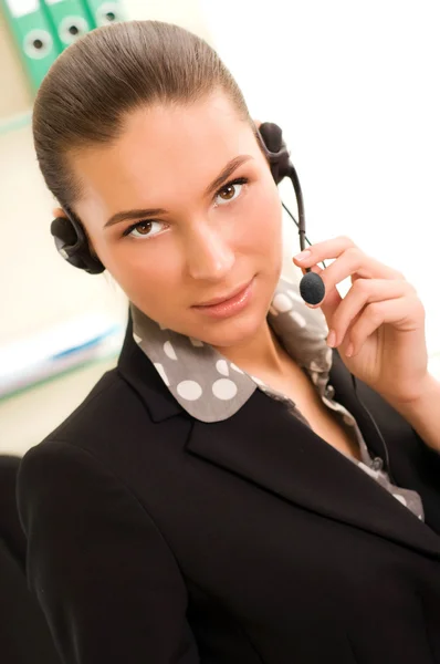Young business woman wearing headphones — Stock Photo, Image