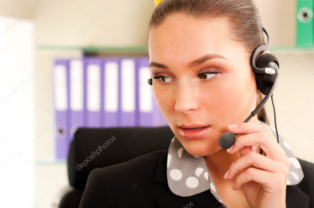 Young business woman wearing headphones