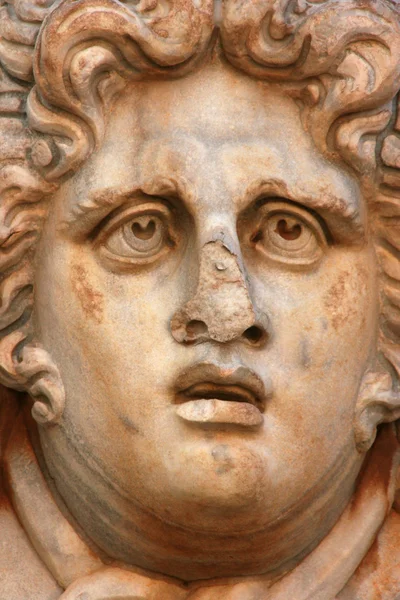 Cara de escultura en la antigua ciudad de Leptis Magna Libia — Foto de Stock