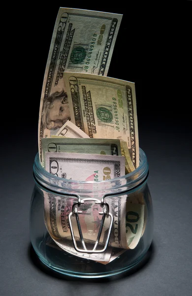 Dólares em jarra de vidro — Fotografia de Stock