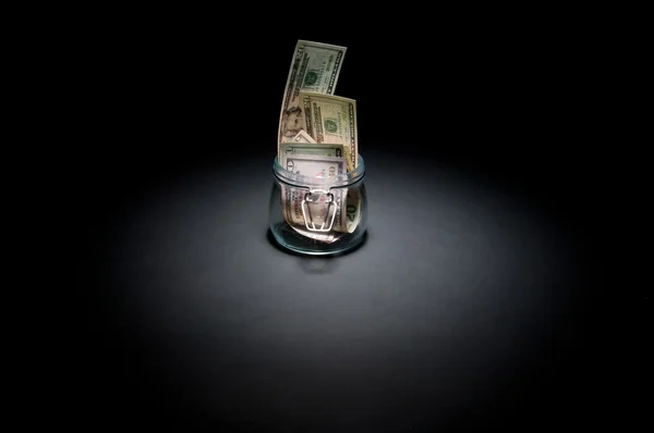 Dólares en frasco de vidrio — Foto de Stock