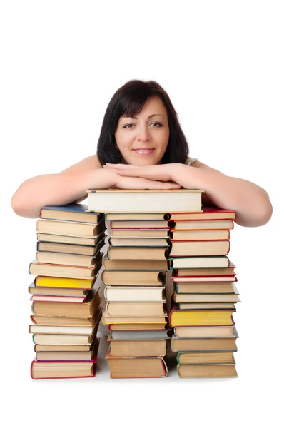 Young smiling woman with heap of books isolated — Stock Photo, Image