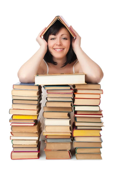 Young smiling woman with heap of books — Stock Photo, Image