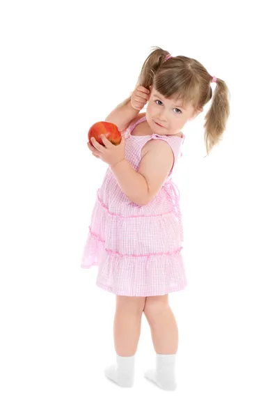 Pequena menina de pé com maçã — Fotografia de Stock