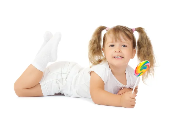 Mała uśmiechnięta dziewczynka z lizakiem — Zdjęcie stockowe