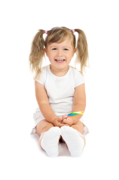 Menina sorridente pequena com pirulito — Fotografia de Stock
