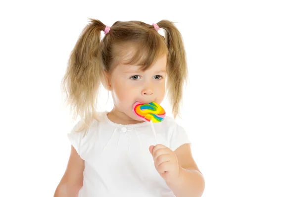 Klein meisje met lolly — Stockfoto