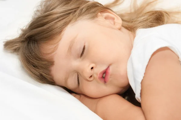 Sleeping girl on bed — Stock Photo, Image