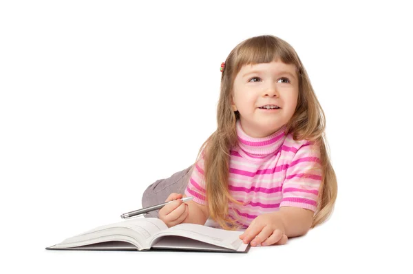 Smiling little writing girl — Stock Photo, Image