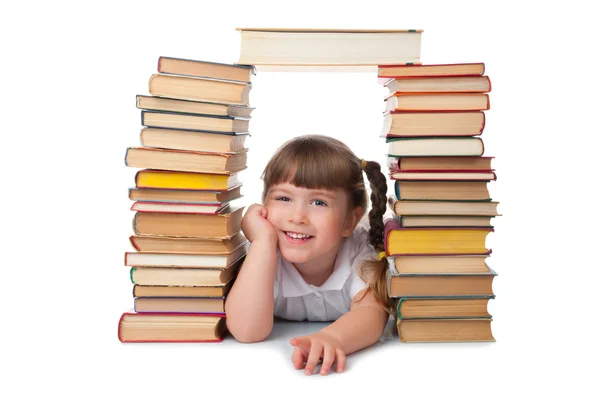 Malá usměvavá dívka s knihami — Stock fotografie