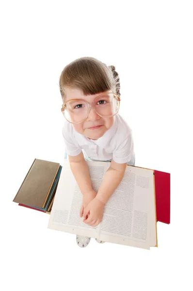 Liten flicka med böcker — Stockfoto