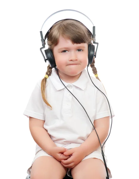 stock image Little girl listens music