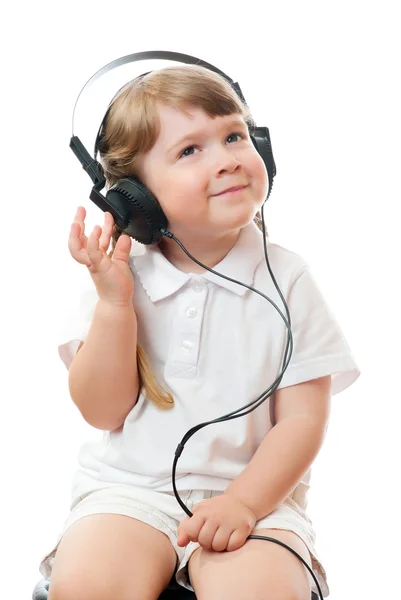 stock image Little girl listens music