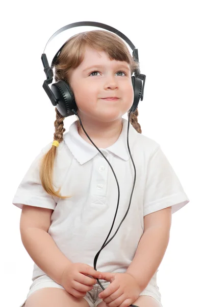 stock image Little girl listens music