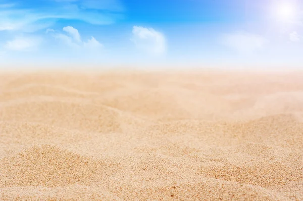 stock image Sand and sky with clouds and sun