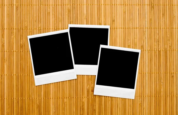 Blank photo frames on bamboo — Stock Photo, Image