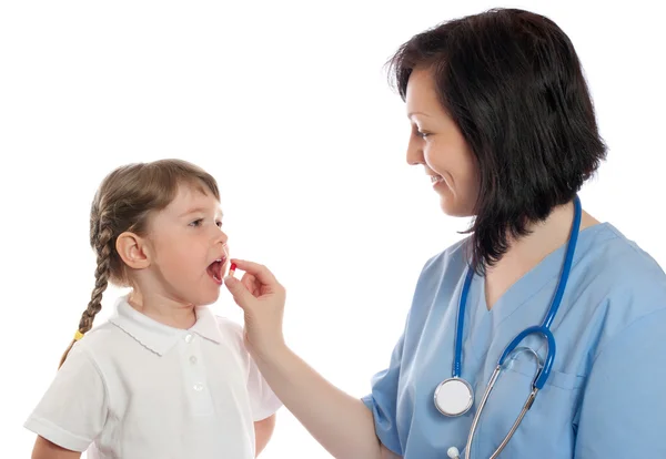 Doctor gives a pill to girl — Stock Photo, Image