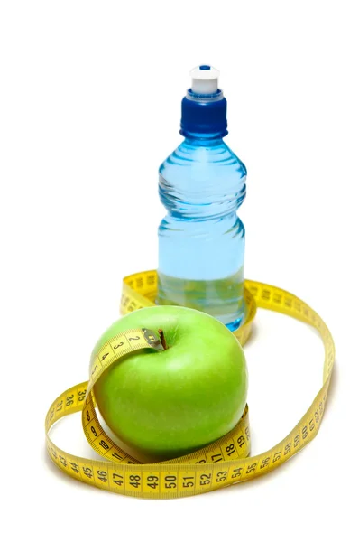 Apple and bottle with water — Stock Photo, Image