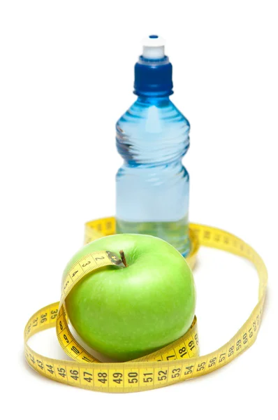 Apple and bottle with water — Stock Photo, Image