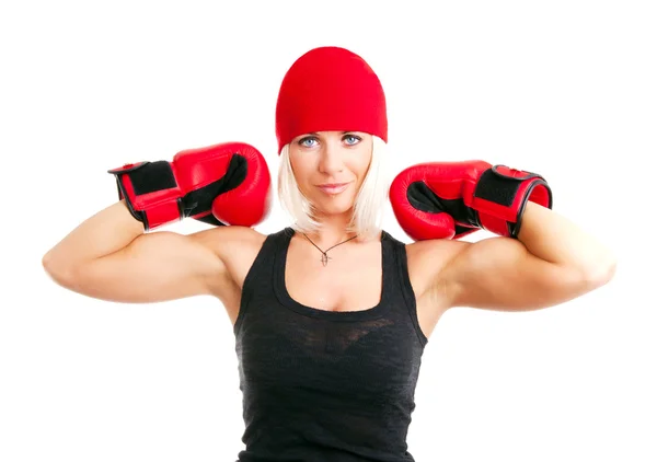 Blond kvinna med boxhandskar utövar — Stockfoto