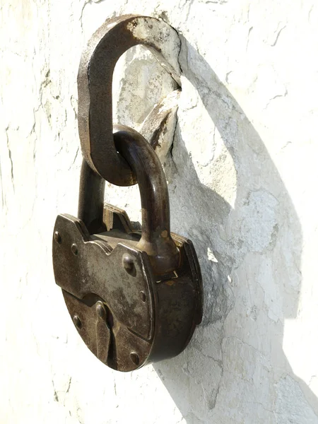 stock image Old locks on a white background of an old wall