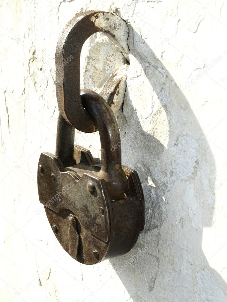 Old locks on a white background of an old wall