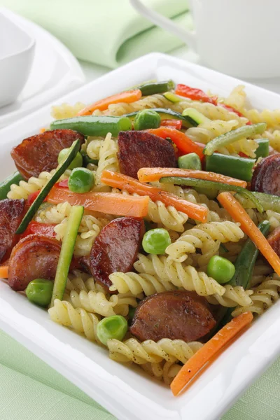 Pasta with sausage and vegetables — Stock Photo, Image