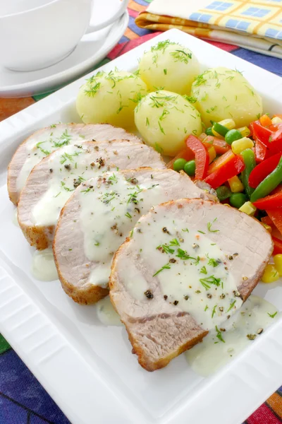 Pork meat with vegetables and sauce — Stock Photo, Image