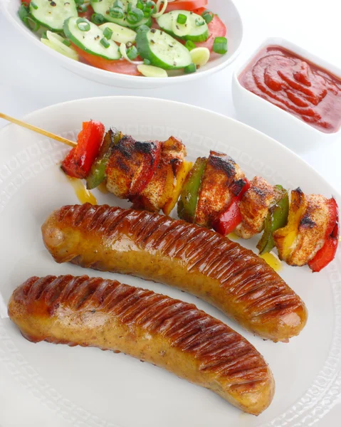 Fried sausage and skewers — Stock Photo, Image
