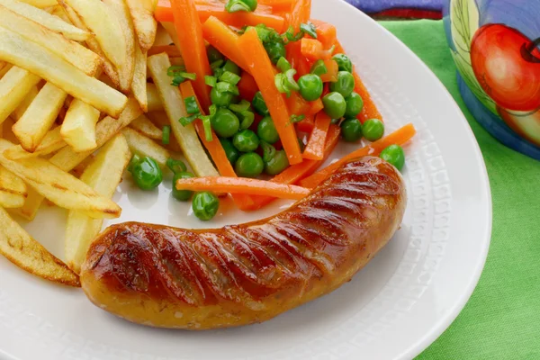 Sausage with french fries and vegetables