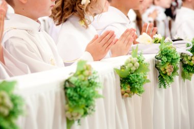 Children accepting the first Holy Communion clipart