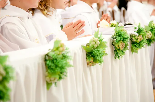 Children accepting the first Holy Communion — Stock Photo, Image
