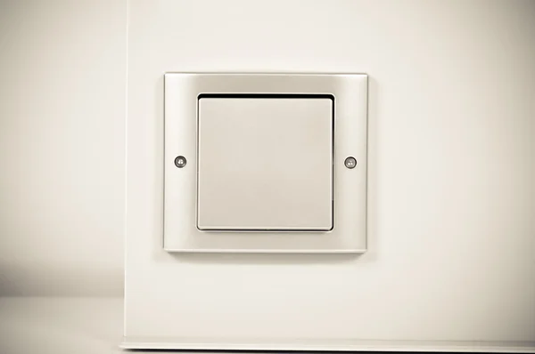 Włącznik światła na ścianie w sepii — Zdjęcie stockowe