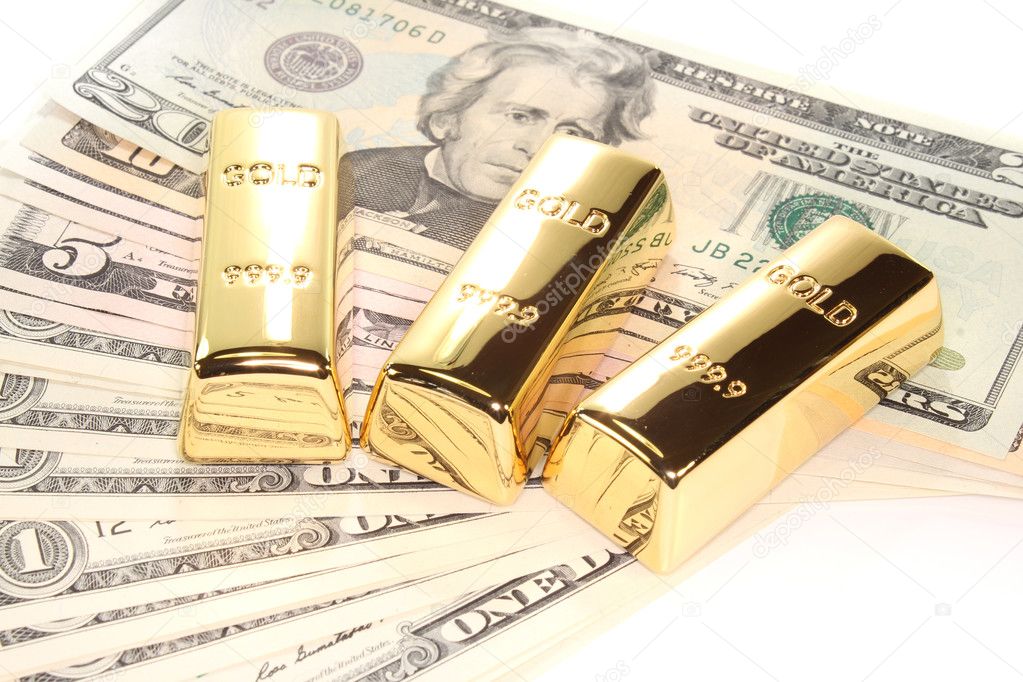 Three gold bars on dollar bills
